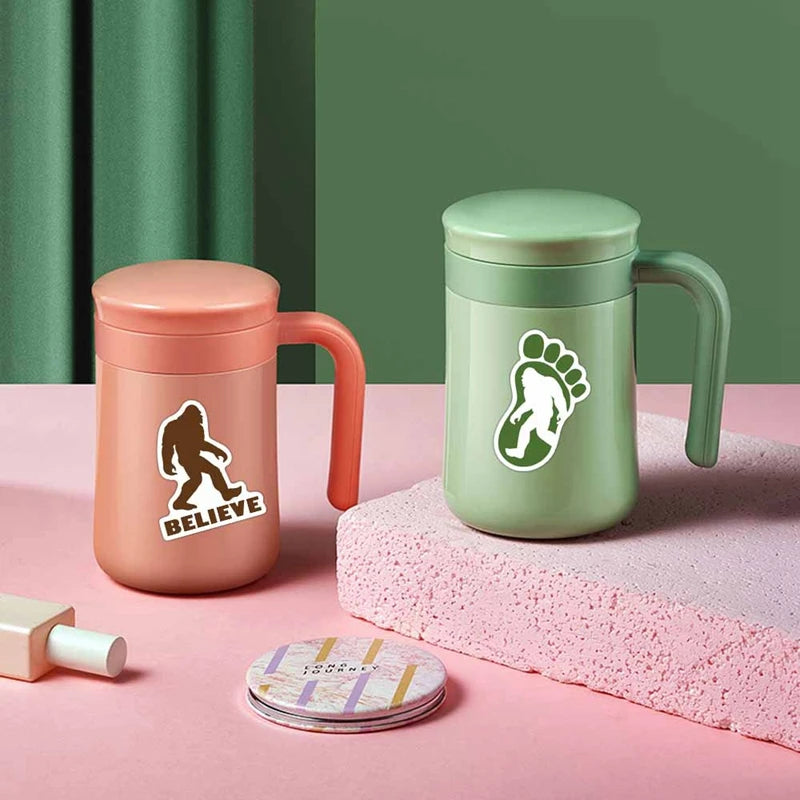 A light green tumbler and a pink tumbler are displayed on a pink surface with a pink textured mat.