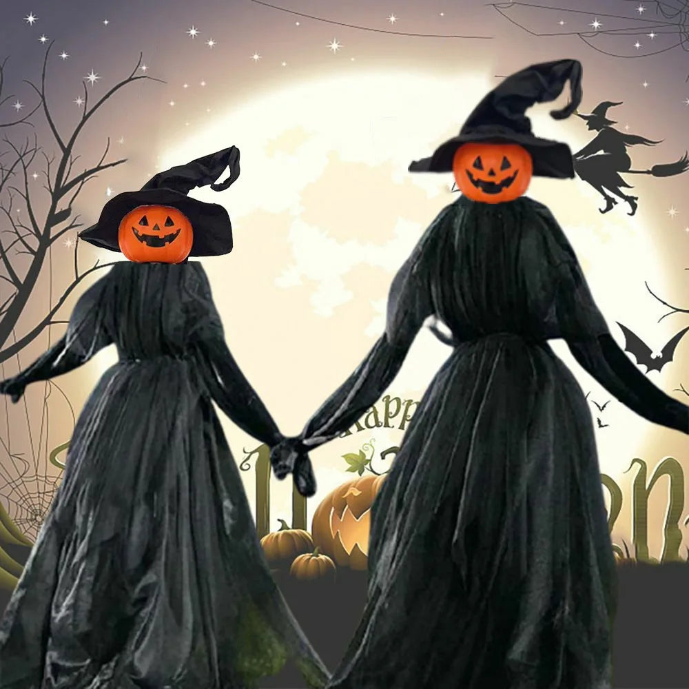 Two witches in black dresses with carved pumpkin heads standing against a glowing background.