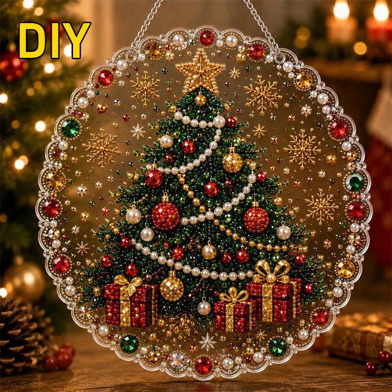 DIY Christmas tree suncatcher made of glitter, pearls, and jewels hanging by a metal chain.