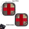 A pair of embroidered IR reflective medical cross tactical morale patches on a dark fabric background.