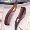 A brown anti-dandruff scalp massage comb with anti-static bristles is shown next to a book.