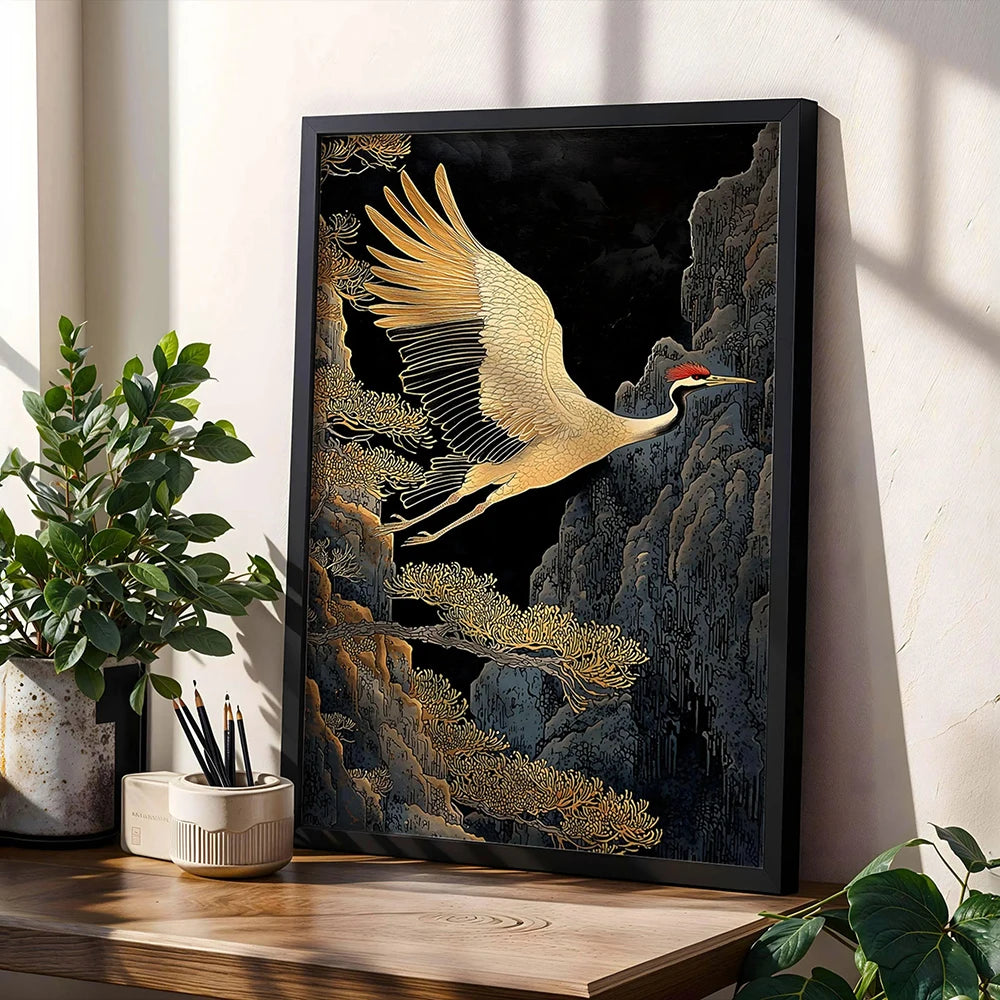 Black framed canvas art depicting a golden crane in flight against a dark, textured background.