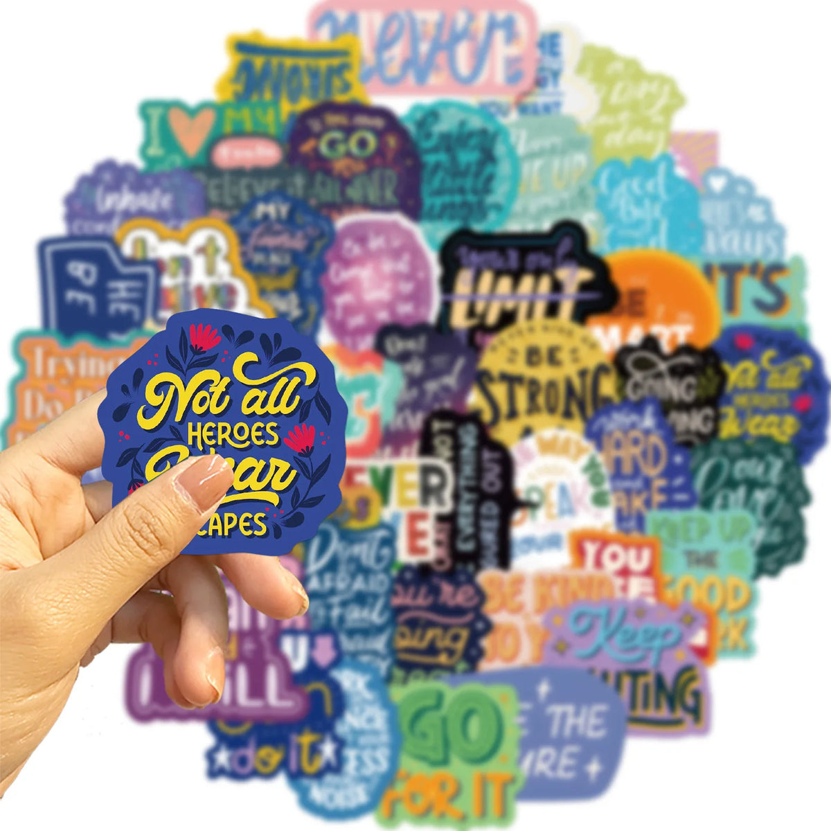 A hand holds a colorful set of inspirational quote stickers on a white background.