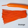 A collection of orange latex strip balloons and one long orange balloon are displayed on a white surface.