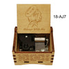 A wooden box containing a music melody box and an illustration of a character, labeled 18-AJ7.