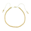 Handmade boho glass bead bracelet with adjustable cord featuring small gold beads.