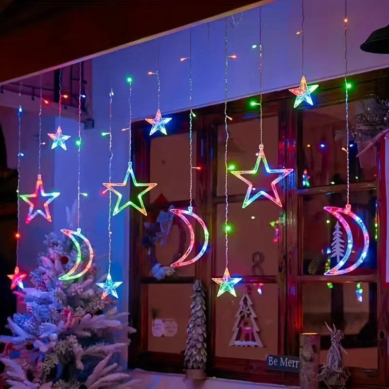 String lights shaped like stars and moons hanging in front of a wooden cabinet for room decor