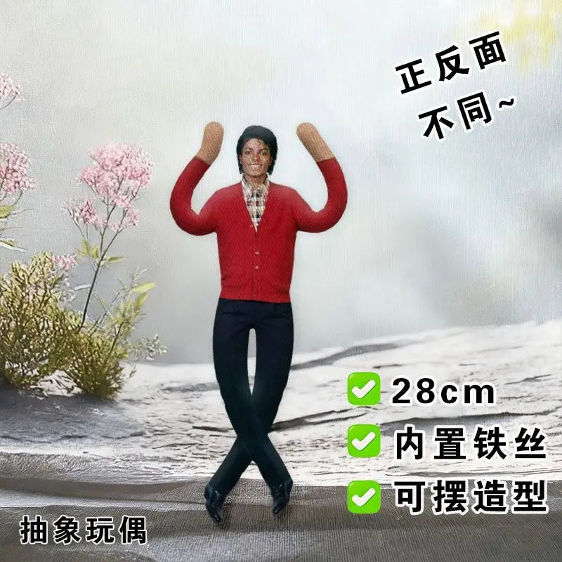 A red plush doll resembling Michael Jackson posing with arms raised against a white background.