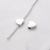 Silver heart-shaped stainless steel bead charms with a thin wire for jewelry making