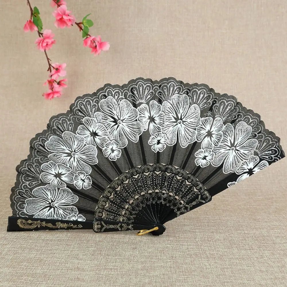 Black and white bamboo flower antique folding fan with intricate detailing