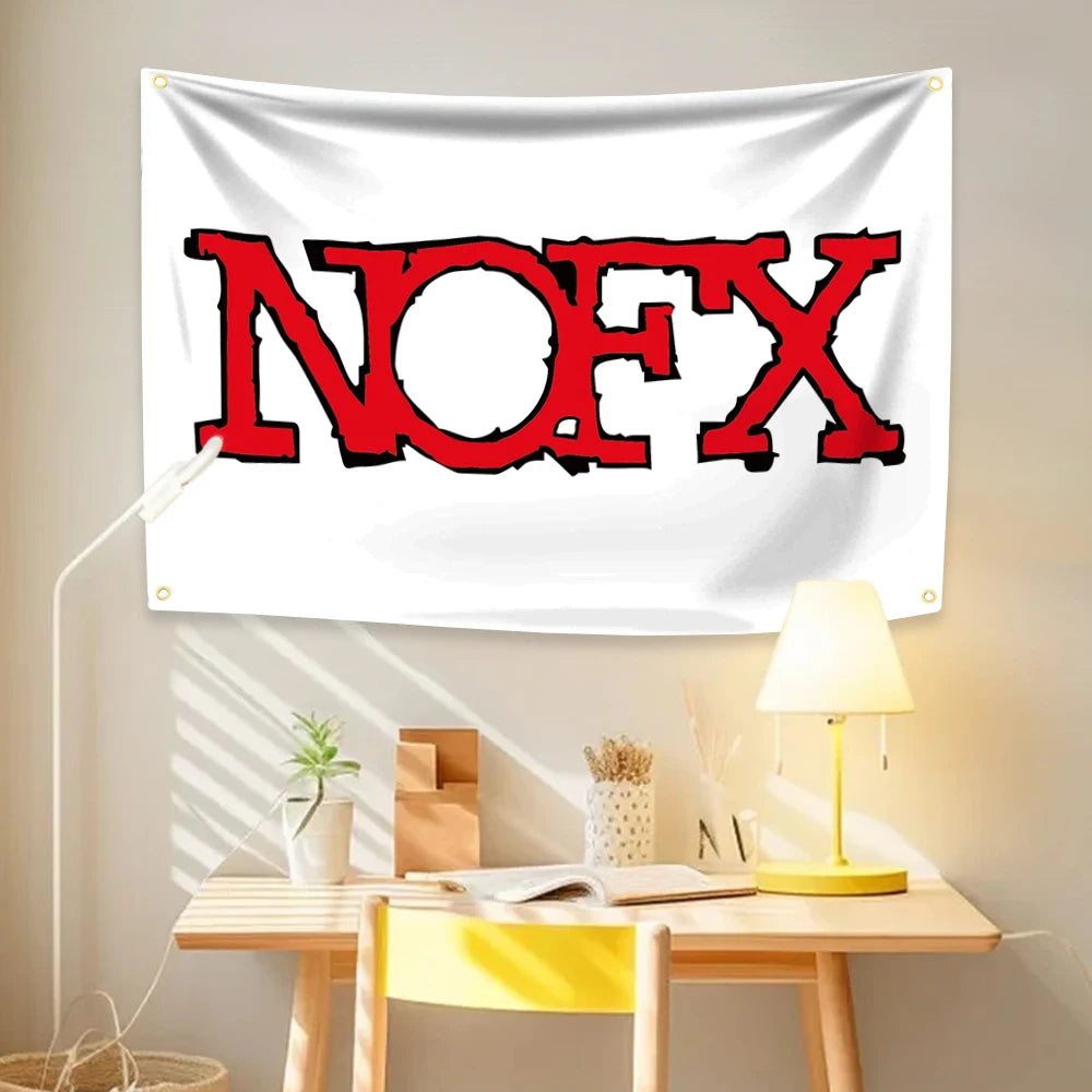 A white tapestry featuring the red text NOFX on a light-colored wall, displayed above a wooden table.