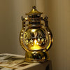 A golden LED lantern night light with a decorative top and a glass globe featuring string lights.