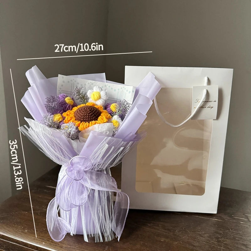 A handmade crochet flower bouquet featuring purple and yellow flowers wrapped in sheer lavender fabric.