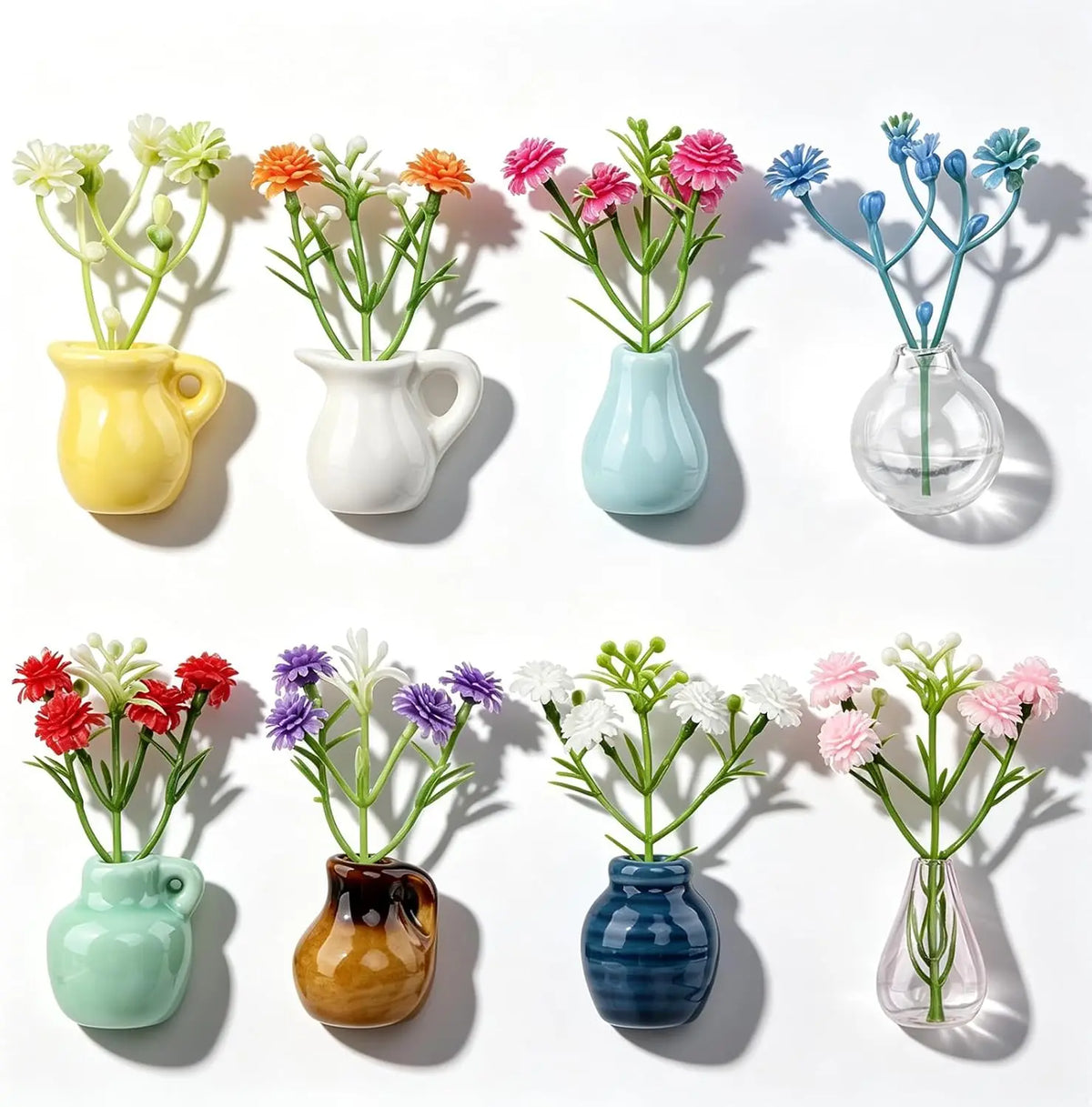 A collection of colorful mini ceramic fridge magnets in various shades including yellow, white, blue, and green.