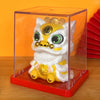 A solar-powered figurine of a white and gold lucky cat with a golden head and yellow body, displayed in a clear box.