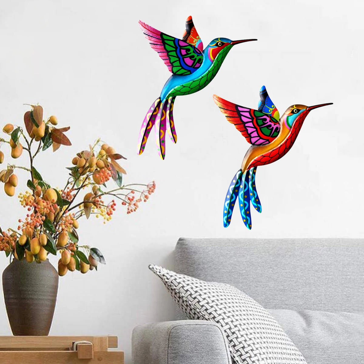 Vibrant metal hummingbird wall art featuring iridescent feathers in red, green, and blue.