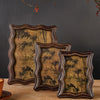 A set of three vintage resin photo frames with distressed gold and dark brown wood accents displayed on a wooden surface.