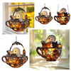 Decorative hanging lantern featuring a ghost reading a book, suitable for window display.