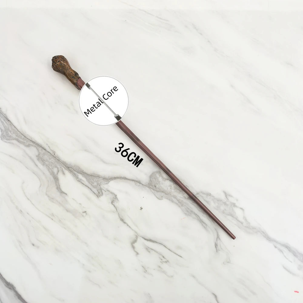 A long, slender metal wand replica with a wooden handle is displayed on a white marble surface.