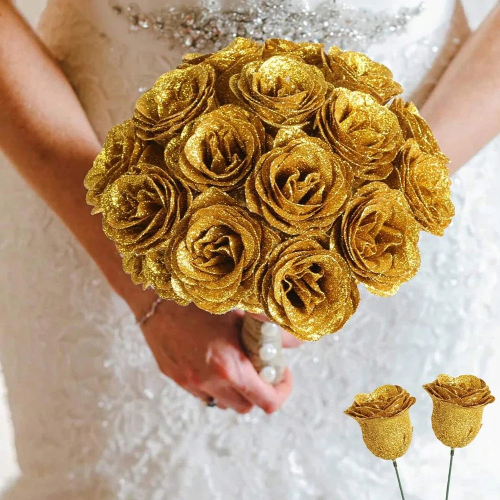 A bouquet of twelve golden glitter artificial roses held by a person in a white dress.