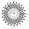 A modern minimalist metal wall clock with a black and silver sunburst design.