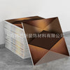 A display of marble peel-and-stick tile stickers with gold accents arranged in a geometric pattern.