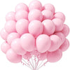 A bunch of pink pastel latex balloons tied together for party decorations