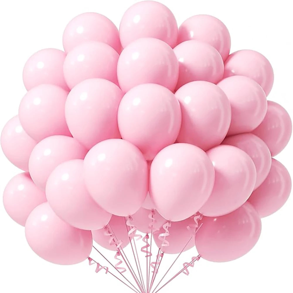 A bunch of pink pastel latex balloons tied together for party decorations