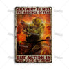 Vintage metal sign with text on a distressed background stating Bravery is not the absence of fear but action in the face of 