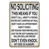 A metal wall sign with text that says No Soliciting This means if you didn't call aren't a friend etc.