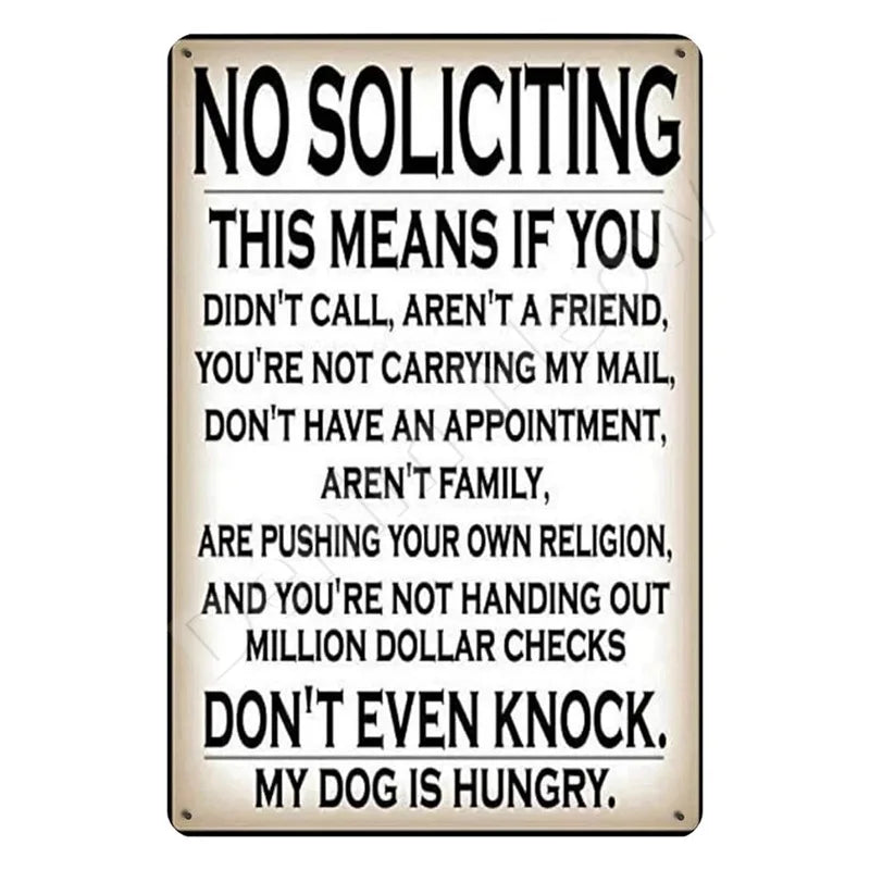 A metal wall sign with text that says No Soliciting This means if you didn't call aren't a friend etc.