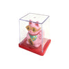 A pink lucky cat figurine wearing gold-rimmed sunglasses displayed in a clear acrylic box on a red base.