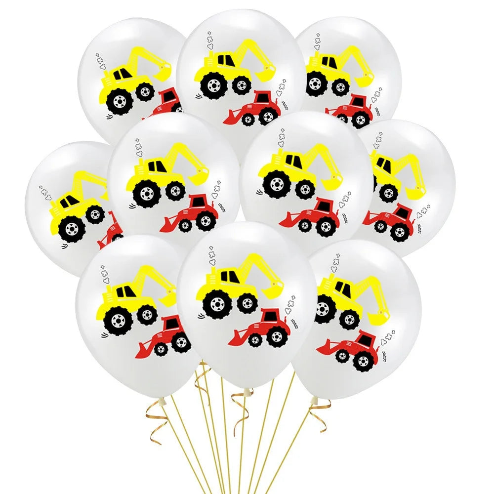 A bunch of white latex balloons featuring yellow construction tractors and red excavators.