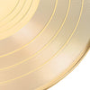 A close-up of a gold vinyl record wall clock with concentric circular lines.