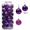 A box containing 24 purple glitter Christmas tree ornament balls.