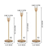 Set of three rose gold metal taper candle holders with 13-inch height and 3.15-inch bases.