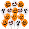 A collection of orange and white latex balloons featuring various spooky, grinning jack-o'-lantern faces.