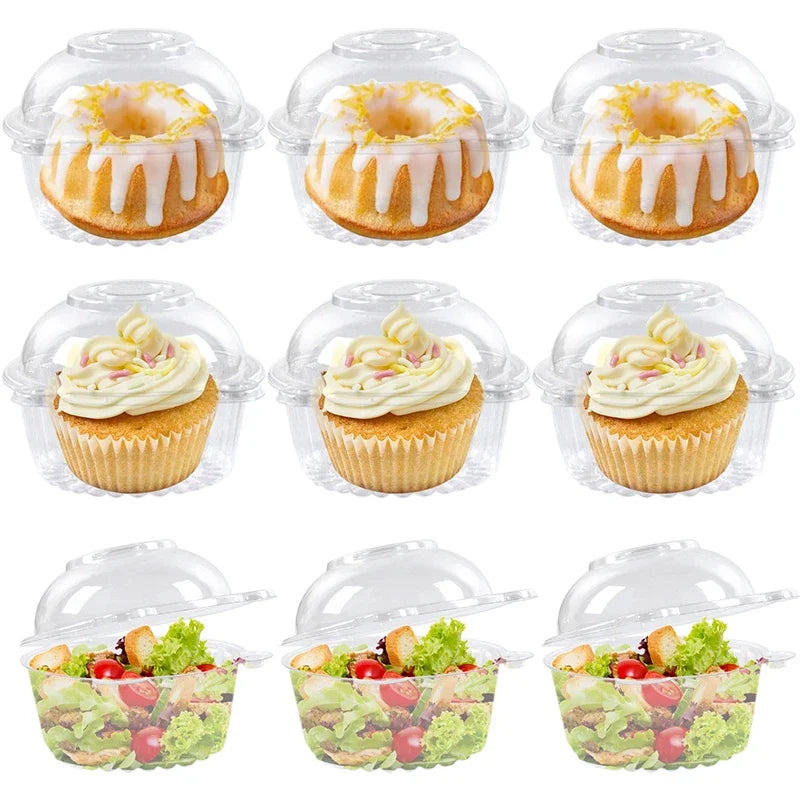 Clear plastic packaging boxes containing various baked goods including muffins and fresh fruit salads