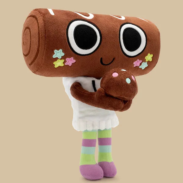 A brown plush toy resembling a character with large eyes and small stars on its face, wearing a white outfit and striped sock