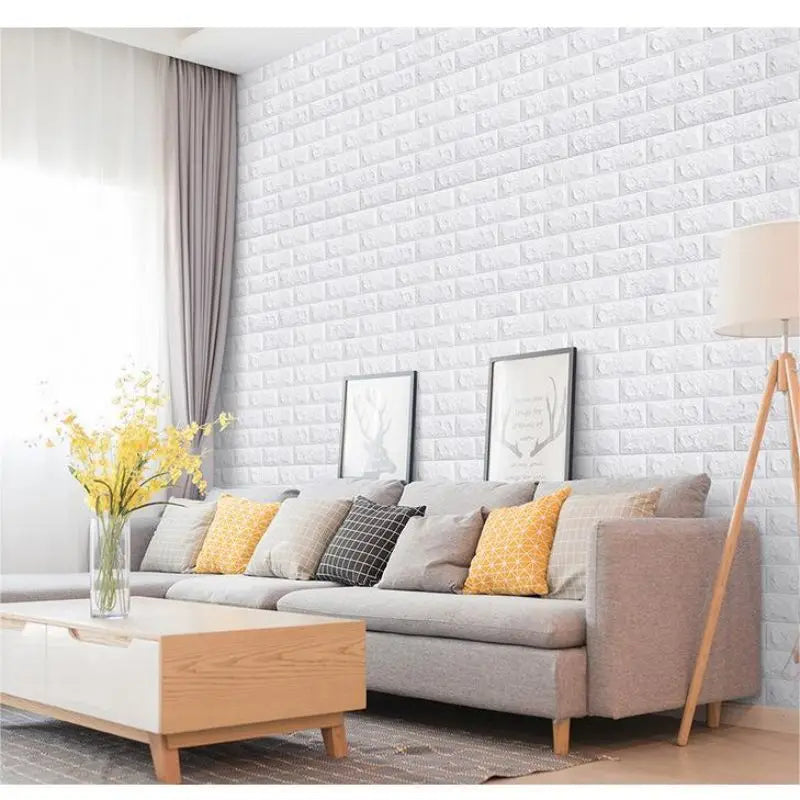 A modern living room featuring a sofa and a white brick wall panel accent.