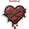 A red heart charm with a barbed wire design and dripping liquid, suitable for craft projects.