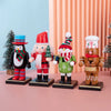 A set of wooden nutcracker soldier ornaments featuring characters dressed in festive winter attire.