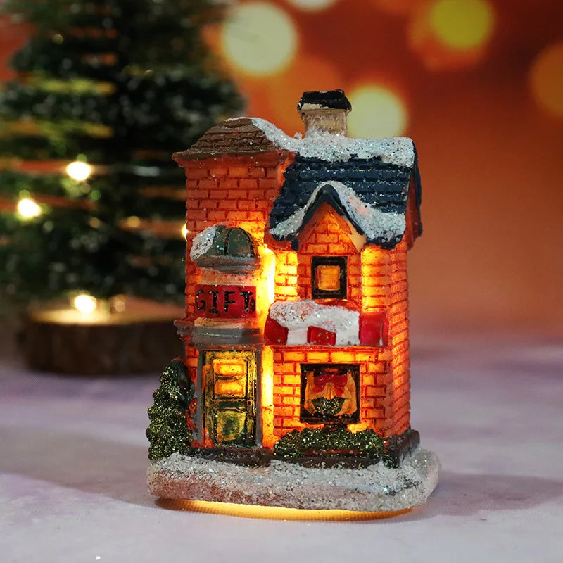 A festive Christmas house night light shaped like a brick building with warm LED glow and snow accents.