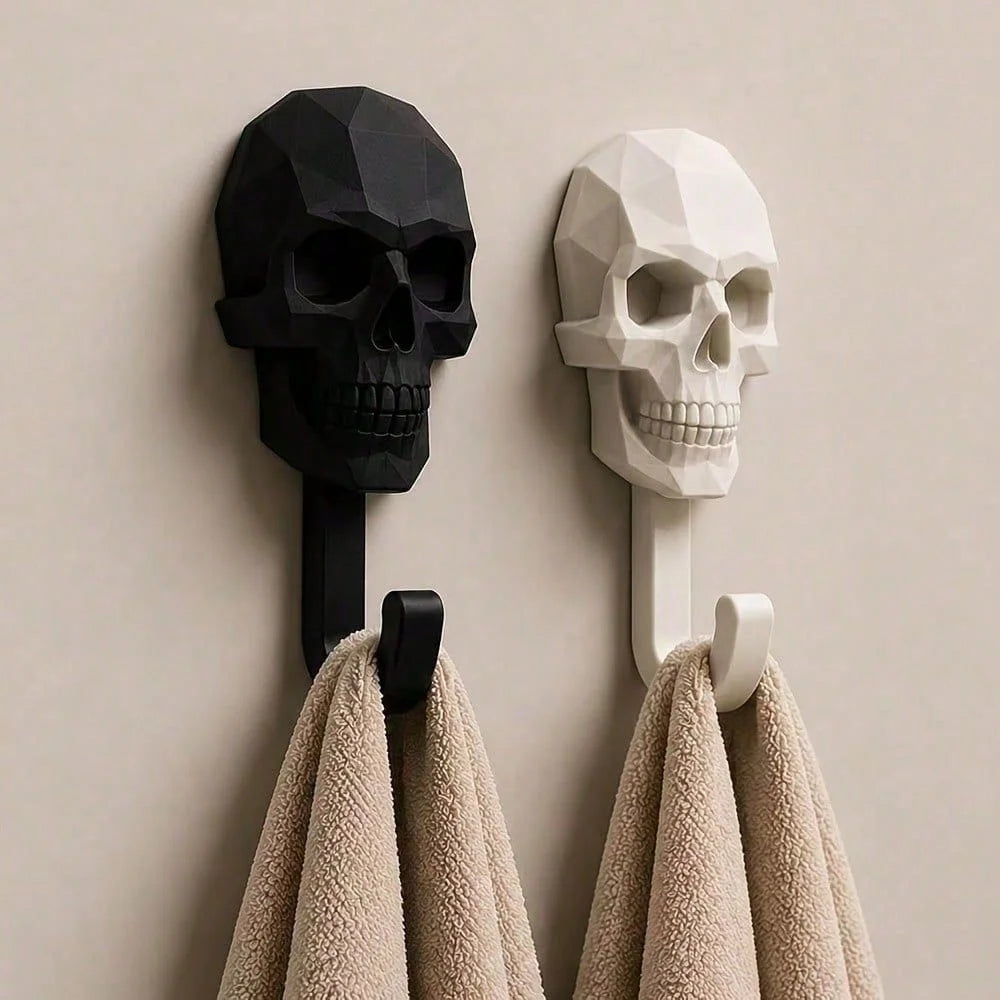A black and white geometric skull wall hook displaying a decorative skull design.
