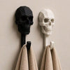 A black and white geometric skull wall hook displaying a decorative skull design.