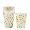 A set of white disposable cups with yellow polka dots.