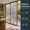 A modern interior view showing a large window with vintage floral mosaic film providing privacy and light.