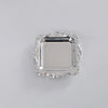 A silver-toned mirror-finish mini tray with an ornate, scalloped edge.