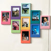 A collection of retro magnetic photo frames in various pastel colors displaying different photographs.