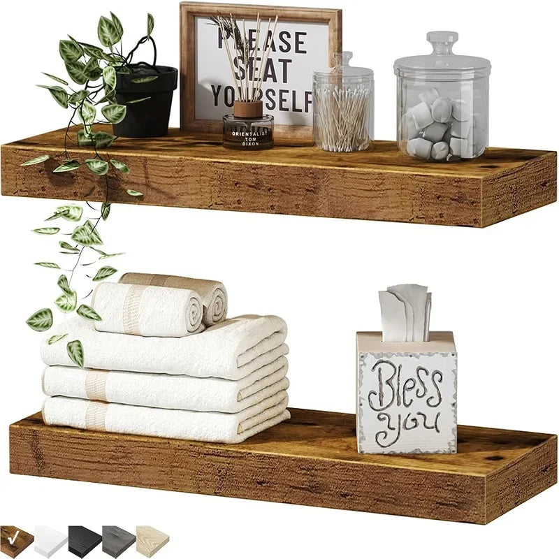A set of floating wall shelves made of sturdy wood construction displaying various decorative items and candles.